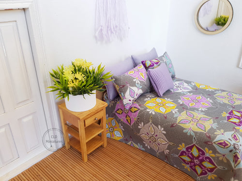 Faux Yellow Flowers in White Plastic Pot