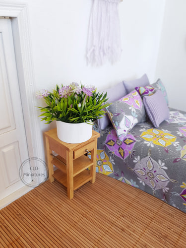 Faux Lilac Flowers in White Plastic Pot