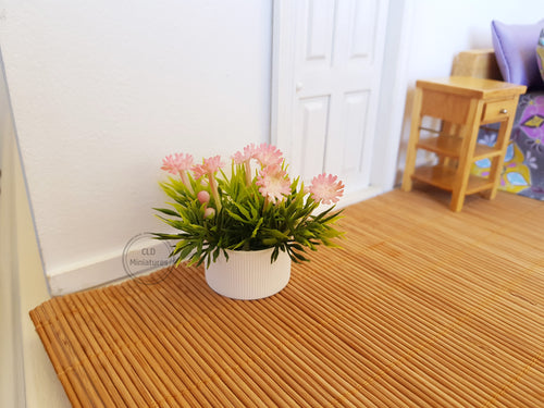 Faux Pink Flowers in White Plastic Pot