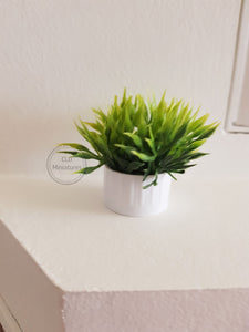 Faux Plant in White Plastic Pot