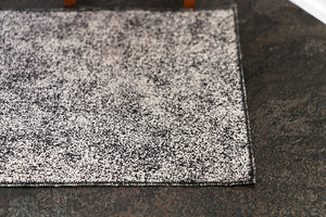 Black and Cream Patterned Rug